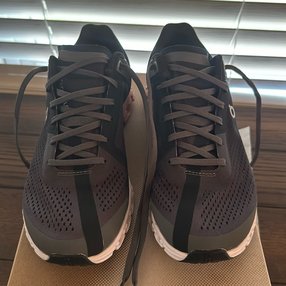 Like new On Cloudflow, dark grey, white and pink.  Size 7